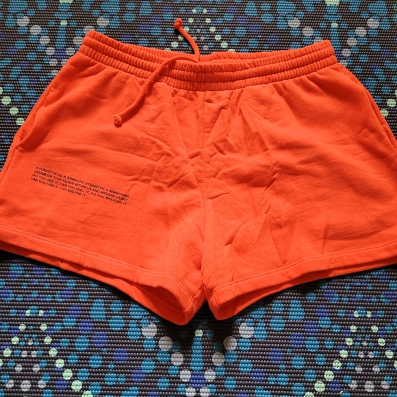 Pangaia Pants - Pangaia neon orange cotton jogging shorts